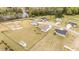 Expansive aerial view showcases meticulously maintained homes with ample outdoor space and a peaceful pond nearby at 127 Hurricane Aly, Benson, NC 27504