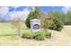 Stone community sign reading 'Madison Landing' surrounded by lush greenery and landscaping at 127 Hurricane Aly, Benson, NC 27504