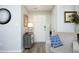 Inviting entryway with wood-look floors, neutral walls, accent furniture, and decor at 127 Hurricane Aly, Benson, NC 27504