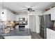 Modern kitchen with stainless steel appliances, granite countertops, and mosaic backsplash at 127 Hurricane Aly, Benson, NC 27504