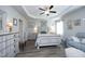 Comfortable primary bedroom with tray ceilings and cozy seating area at 127 Hurricane Aly, Benson, NC 27504