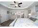 Spacious bedroom featuring tray ceiling, neutral decor, and access to ensuite bathroom at 127 Hurricane Aly, Benson, NC 27504