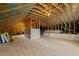 Large unfinished attic with exposed wooden beams, perfect for future expansion at 128 School Side Dr, Spring Lake, NC 28390