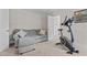 Carpeted flex room includes a couch and workout equipment at 128 School Side Dr, Spring Lake, NC 28390