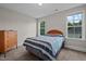 Bedroom featuring carpet floors, two large windows, and natural lighting at 128 School Side Dr, Spring Lake, NC 28390