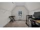Upstairs bonus room with a window and built in shelving at 128 School Side Dr, Spring Lake, NC 28390