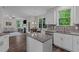 Bright open kitchen featuring granite countertops, stainless steel appliances, and an adjacent living area at 128 School Side Dr, Spring Lake, NC 28390
