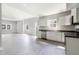 Bright, open floor plan with a modern kitchen with stainless steel appliances and ample cabinet space at 129 Burwell Avenue Ave, Henderson, NC 27536