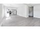 Expansive living room showcases open concept design and flows seamlessly to the kitchen with stainless steel appliances at 129 Burwell Avenue Ave, Henderson, NC 27536