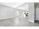Open-concept living area with access to the modern kitchen and ample natural light from the windows at 129 Burwell Avenue Ave, Henderson, NC 27536