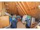 Unfinished attic with exposed beams and insulation with lots of storage at 1312 Golden Bluff Ln, Fuquay Varina, NC 27526