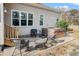 Backyard patio featuring a hot tub with steps, wicker furniture and mature landscaping at 1312 Golden Bluff Ln, Fuquay Varina, NC 27526