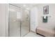 Bathroom with glass shower, storage, and neutral finishes create a serene and functional space at 1312 Golden Bluff Ln, Fuquay Varina, NC 27526