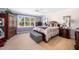 Spacious primary bedroom with a ceiling fan, and a window view at 1312 Golden Bluff Ln, Fuquay Varina, NC 27526