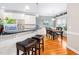 Open kitchen with bar seating and a dining area with natural light at 1312 Golden Bluff Ln, Fuquay Varina, NC 27526