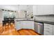 Spacious kitchen with stainless steel appliances and wood floors at 1312 Golden Bluff Ln, Fuquay Varina, NC 27526