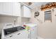 Laundry room with appliances and ample storage space at 1312 Golden Bluff Ln, Fuquay Varina, NC 27526
