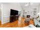 Cozy living room with fireplace, hardwood floors, and comfortable seating at 1312 Golden Bluff Ln, Fuquay Varina, NC 27526