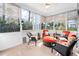 Cozy sunroom with lots of windows, ceiling fan, white walls, and wicker seating and furniture at 1312 Golden Bluff Ln, Fuquay Varina, NC 27526
