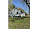 Side view of a home featuring vinyl siding and a yard at 141 N Bullock St, Henderson, NC 27536