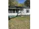 Charming single-story home with vinyl siding and a dark roof at 141 N Bullock St, Henderson, NC 27536