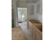 Kitchen undergoing renovations, showcasing new cabinets and adjacent room at 141 N Bullock St, Henderson, NC 27536