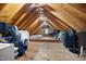 Spacious attic with exposed wood beams, offering ample storage at 1550 Pathway Dr, Carrboro, NC 27510