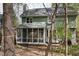 Backyard view featuring the screened-in porch of the home at 1550 Pathway Dr, Carrboro, NC 27510