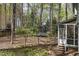 Backyard view of home with a swing set and play area at 1550 Pathway Dr, Carrboro, NC 27510