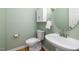Half-bathroom with hardwood floors and a toilet at 1550 Pathway Dr, Carrboro, NC 27510