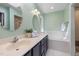 Bathroom featuring double sinks, a soaking tub, and lots of natural light at 1550 Pathway Dr, Carrboro, NC 27510