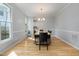 Elegant dining room with ample natural light and stylish chandelier at 1550 Pathway Dr, Carrboro, NC 27510