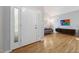 Light-filled foyer with hardwood floors that flow into a living room and showcase the home's open layout at 1550 Pathway Dr, Carrboro, NC 27510