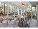 Screened-in porch with ceiling fan and room for a table and six chairs at 1550 Pathway Dr, Carrboro, NC 27510