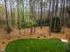 Lush backyard view featuring mature trees and green grass at 160 Sweet Pine Cir, Pittsboro, NC 27312