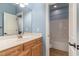 Powder blue bathroom with double sink vanity and separate tub and toilet space at 160 Sweet Pine Cir, Pittsboro, NC 27312