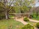 Community pavilion features seating area, fireplace, and pond at 160 Sweet Pine Cir, Pittsboro, NC 27312