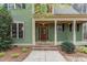 Inviting home exterior featuring a covered front porch with detailed columns and a charming entrance at 160 Sweet Pine Cir, Pittsboro, NC 27312