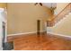 Spacious living room features high ceilings, hardwood floors, a fireplace, and ample natural light at 160 Sweet Pine Cir, Pittsboro, NC 27312
