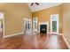 Spacious living room features high ceilings, hardwood floors, a fireplace, and ample natural light at 160 Sweet Pine Cir, Pittsboro, NC 27312