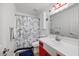 Stylish bathroom with a patterned shower curtain and nautical accents at 163 Ridge Way Ln, Clayton, NC 27520