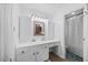 Clean bathroom featuring white cabinetry and countertops, with shower and ample vanity space at 163 Ridge Way Ln, Clayton, NC 27520
