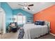 Bright bedroom featuring colorful walls, a ceiling fan, and an abundance of natural light at 163 Ridge Way Ln, Clayton, NC 27520