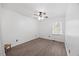 Clean bedroom with natural light, tile floors, and a ceiling fan at 163 Ridge Way Ln, Clayton, NC 27520