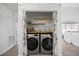 Convenient laundry room with modern appliances and storage shelves at 163 Ridge Way Ln, Clayton, NC 27520