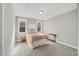 Bright bedroom features two large windows and neutral color palette at 201 W Amber Oak Drive, Selma, NC 27576