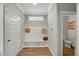 Welcoming entryway with built-in bench and storage, offering a practical and stylish space for coats and shoes at 201 W Amber Oak Drive, Selma, NC 27576
