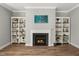 Elegant fireplace with built-in bookcases at 201 W Amber Oak Drive, Selma, NC 27576