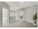 Upstairs landing area with doorways to various rooms, neutral carpet, and a glimpse of a bedroom at 201 W Amber Oak Drive, Selma, NC 27576