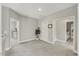 Spacious upstairs hallway with neutral carpet and paint, offering access to multiple rooms and ample natural light at 201 W Amber Oak Drive, Selma, NC 27576